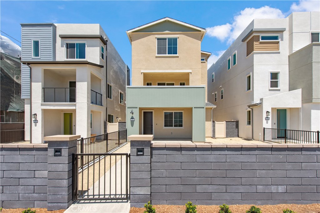 211 Ruby Road Rancho Mission Viejo, CA 92694 - Photo 4 of 41 a front view of a house with glass windows