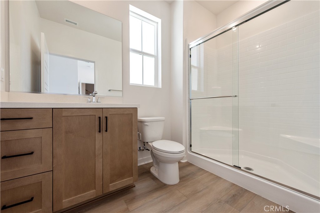 211 Ruby Road Rancho Mission Viejo, CA 92694 - Photo 9 of 41 a bathroom with a sink a toilet and shower