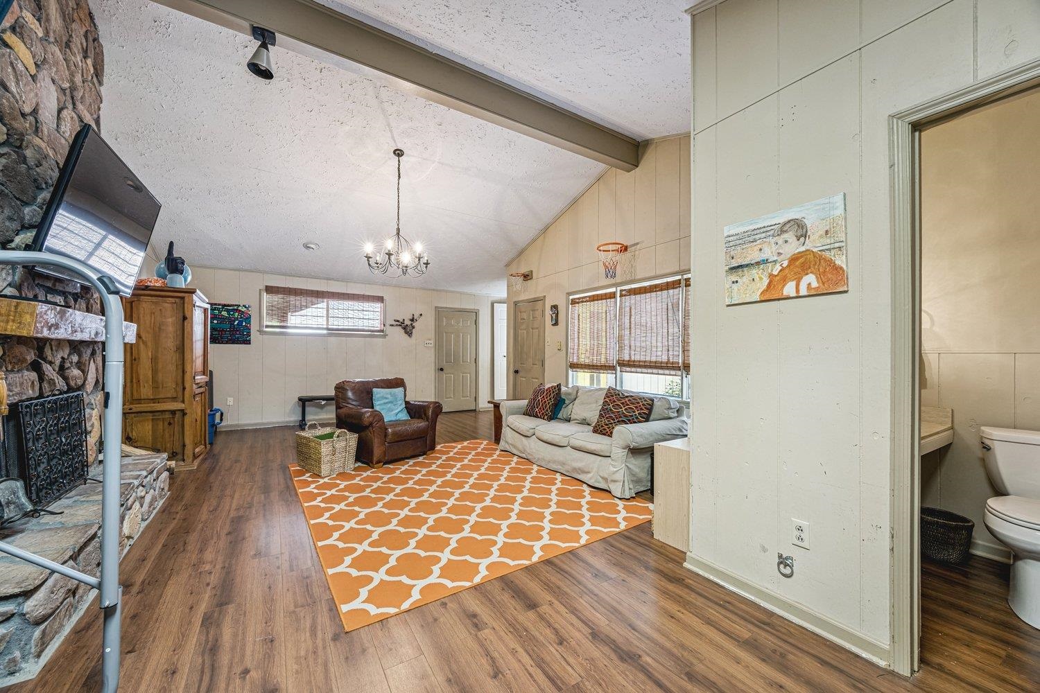 4220 Minden Road Memphis, TN 38117 - Photo 23 of 30 a living room with furniture and a chandelier