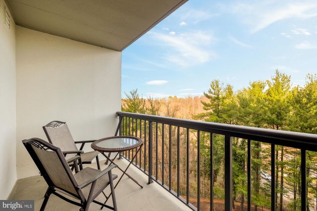 a view of a balcony with furniture