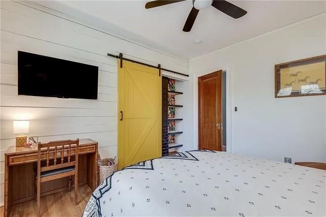 3353 Myrtle Street Hapeville, GA 30354 - Photo 13 of 22 a bedroom with a bed and a flat screen tv