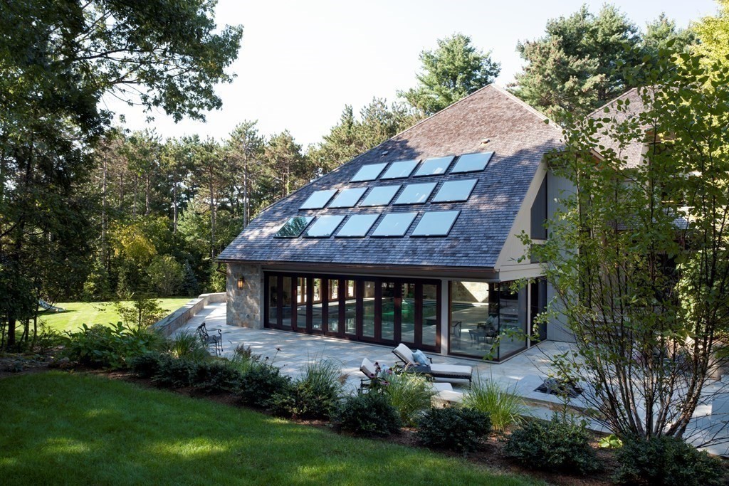 51 Scotch Pine Road Wellesley, MA 02481 - Photo 15 of 30 a backyard of a house with a garden and deck
