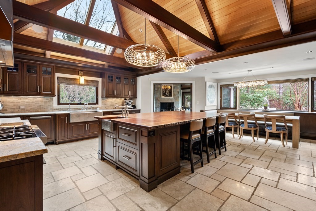 51 Scotch Pine Road Wellesley, MA 02481 - Photo 8 of 30 a kitchen with a stove a sink a counter space and stainless steel appliances