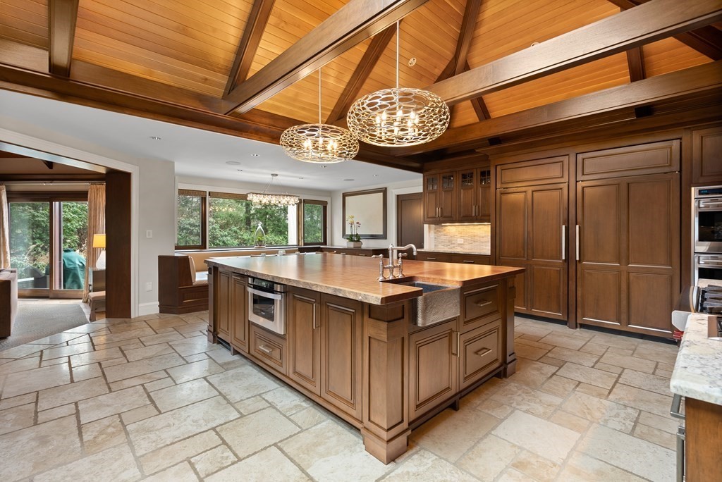 51 Scotch Pine Road Wellesley, MA 02481 - Photo 9 of 30 a kitchen with stainless steel appliances granite countertop a stove a sink and a refrigerator