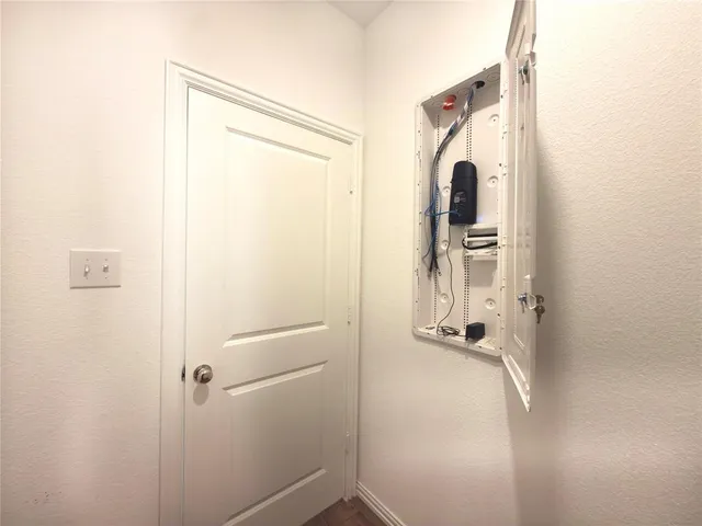 a bathroom with a glass shower door