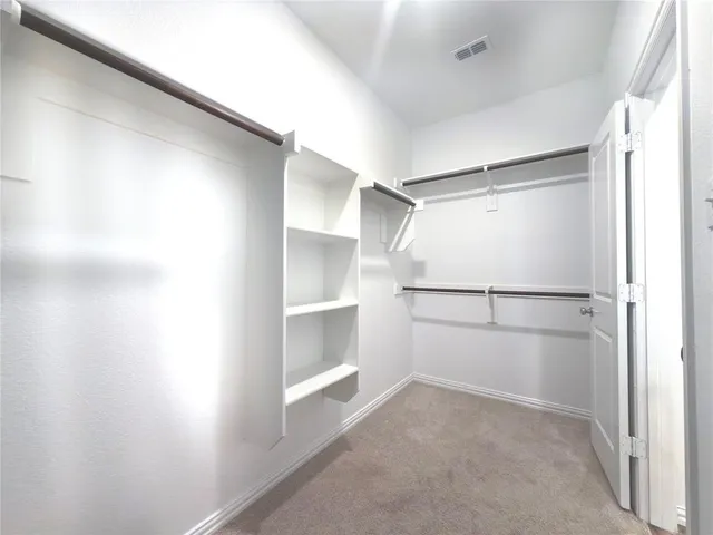 a view of an empty walk in closet