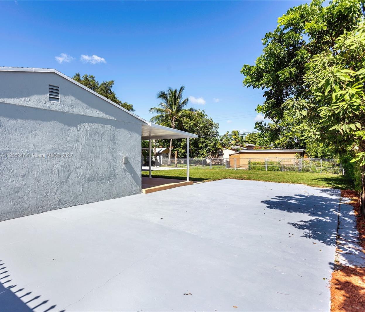 551 East 39th Street Hialeah, FL 33013 - Photo 3 of 8 a view of swimming pool with outdoor seating and yard in the back