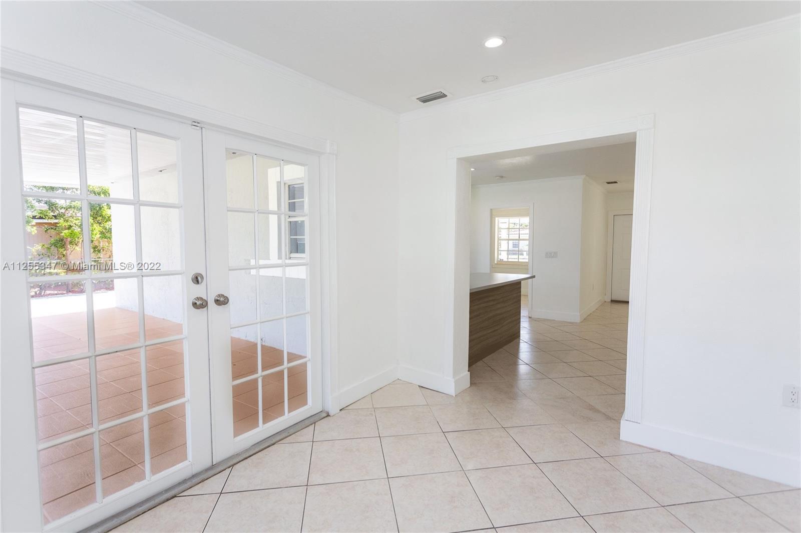 551 East 39th Street Hialeah, FL 33013 - Photo 4 of 8 view of an empty room with a window