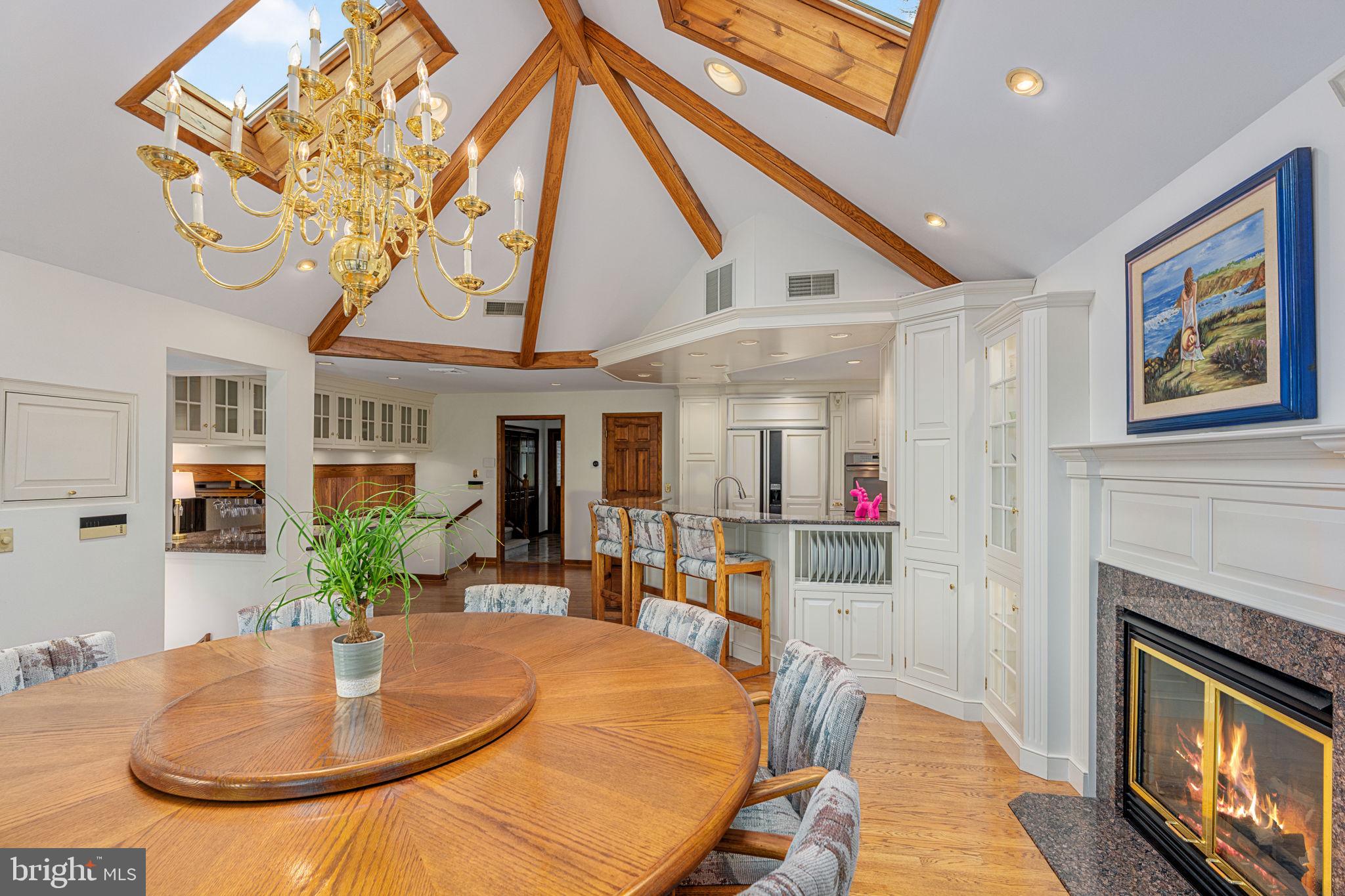 1995 Peppermint Road Coopersburg, PA 18036 - Photo 16 of 67 a dining room with furniture a fireplace and chandelier