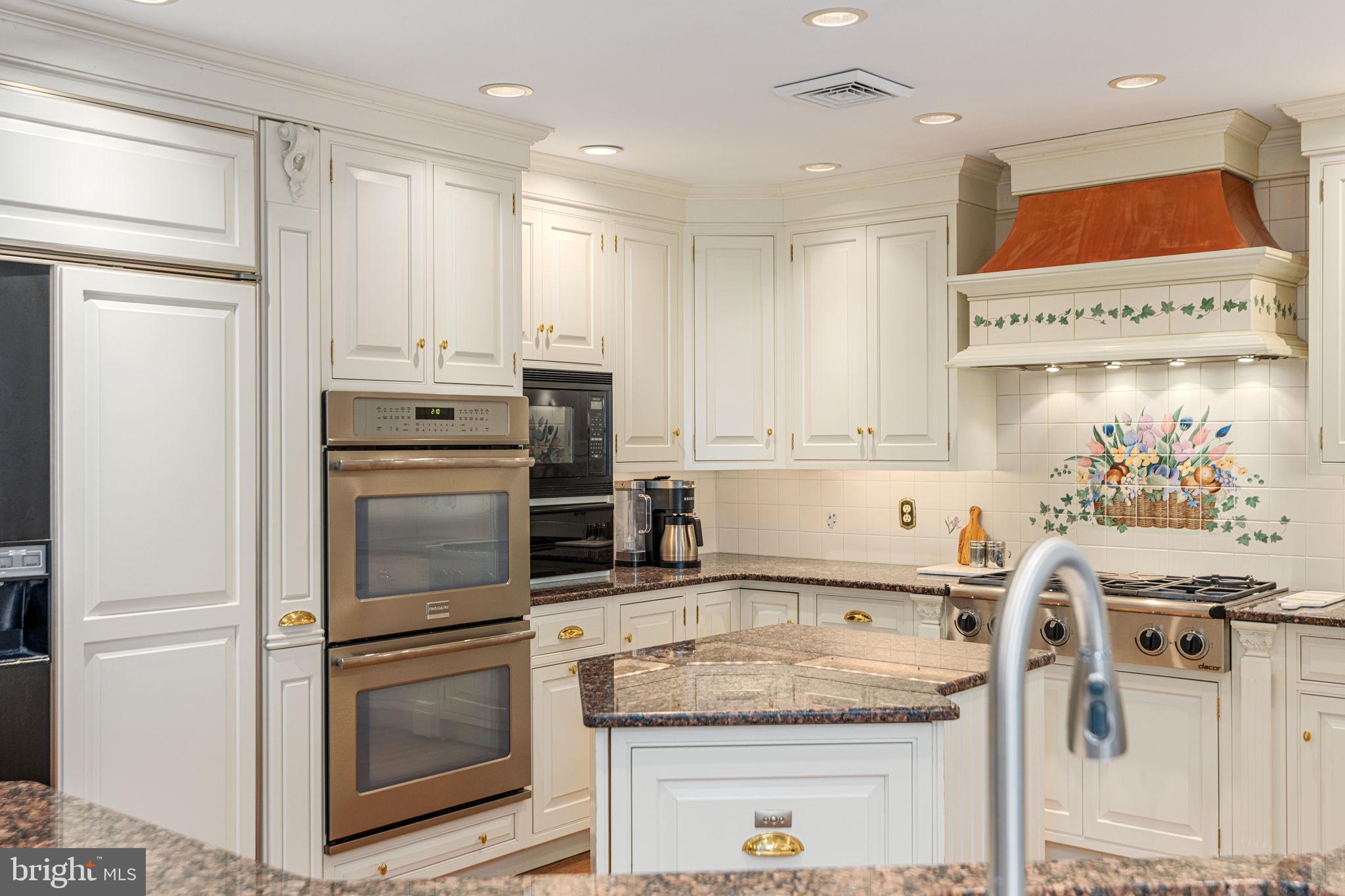 1995 Peppermint Road Coopersburg, PA 18036 - Photo 20 of 67 a kitchen with stainless steel appliances granite countertop a refrigerator sink stove and white cabinets