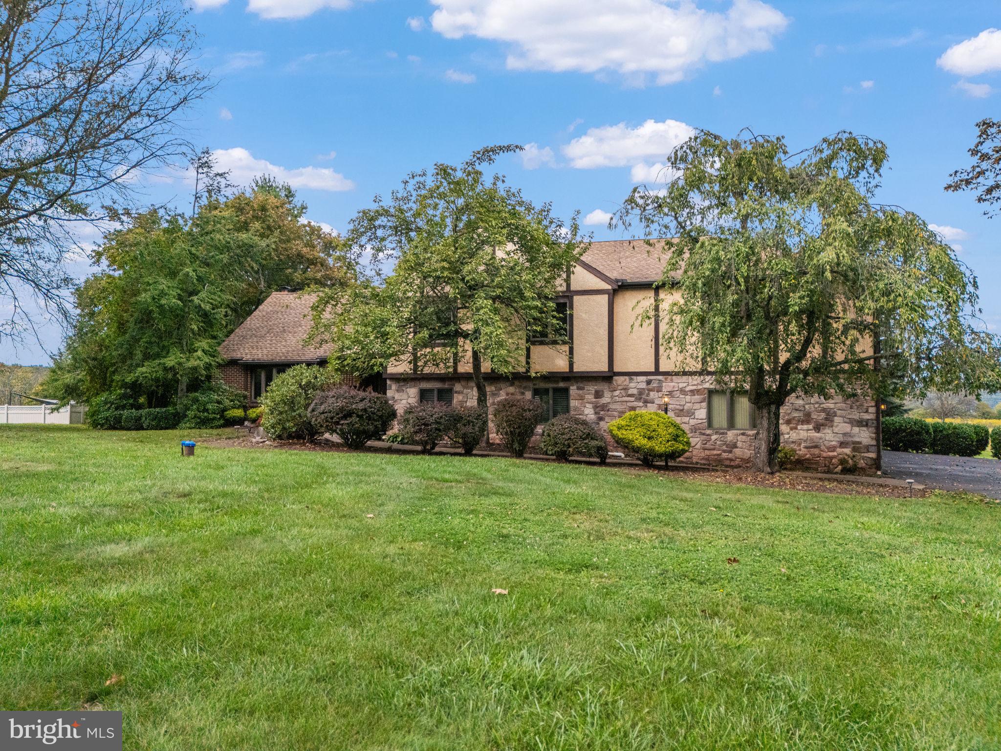 1995 Peppermint Road Coopersburg, PA 18036 - Photo 2 of 67 a view of a house with backyard and garden