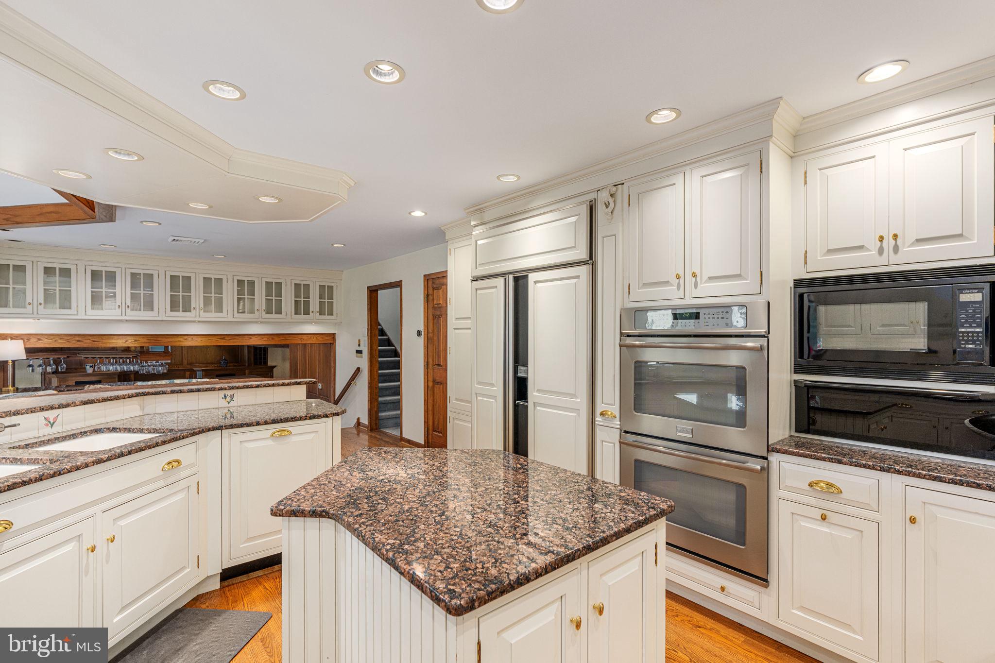 1995 Peppermint Road Coopersburg, PA 18036 - Photo 23 of 67 a kitchen with stainless steel appliances granite countertop a stove a sink and a refrigerator