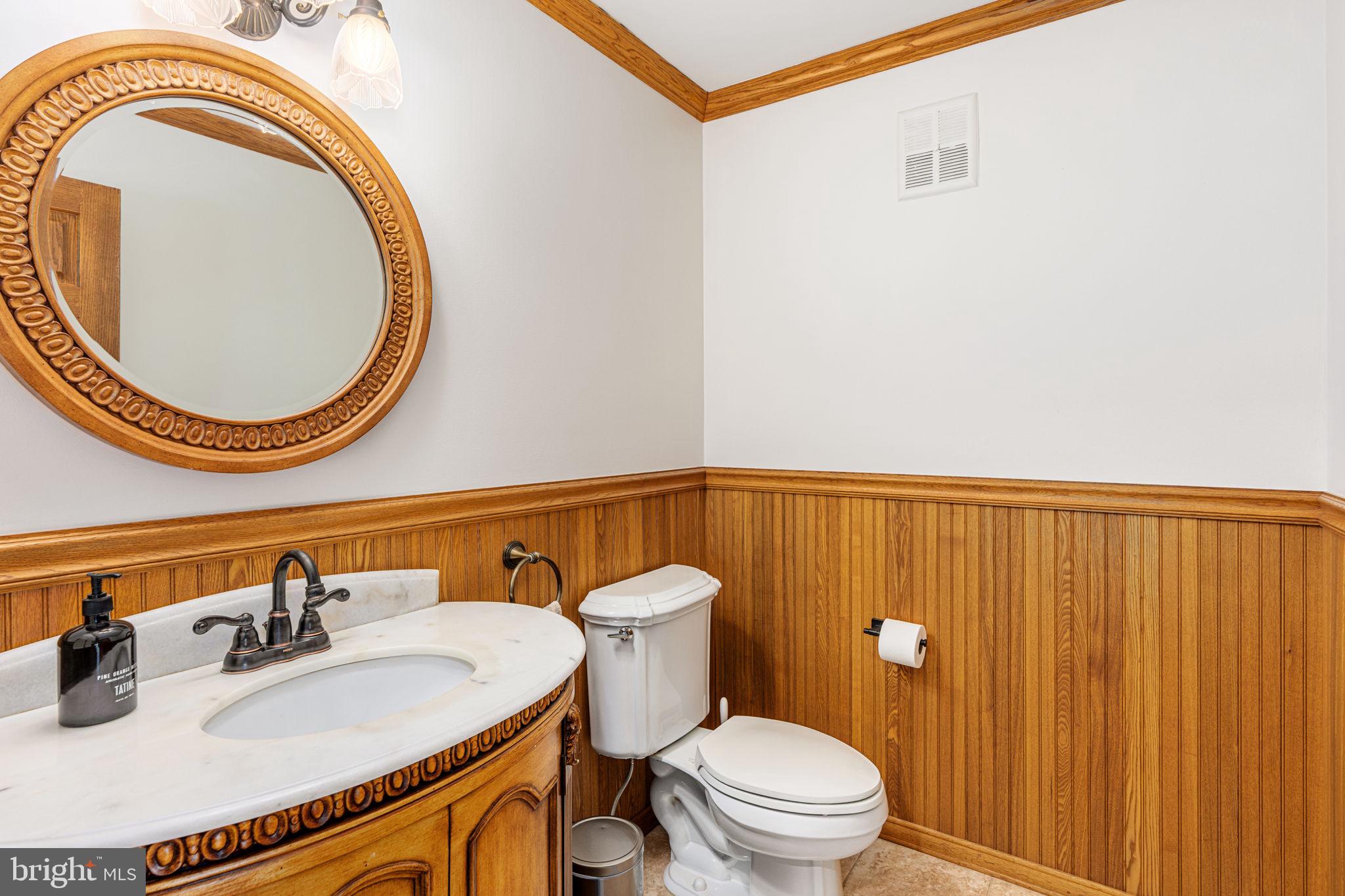 1995 Peppermint Road Coopersburg, PA 18036 - Photo 40 of 67 a bathroom with a sink a toilet and a mirror