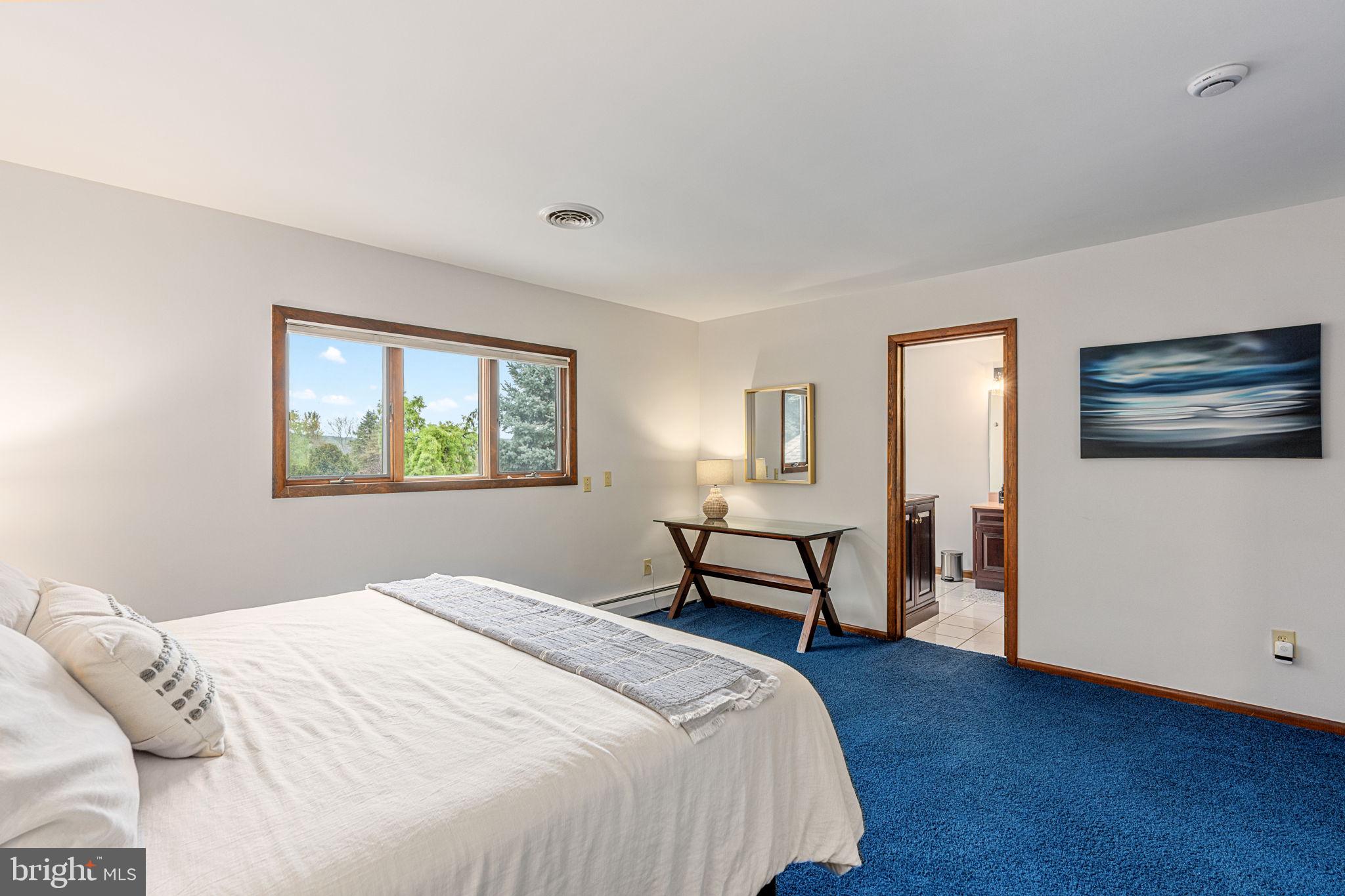 1995 Peppermint Road Coopersburg, PA 18036 - Photo 48 of 67 a bedroom with a bed wall painting and a window