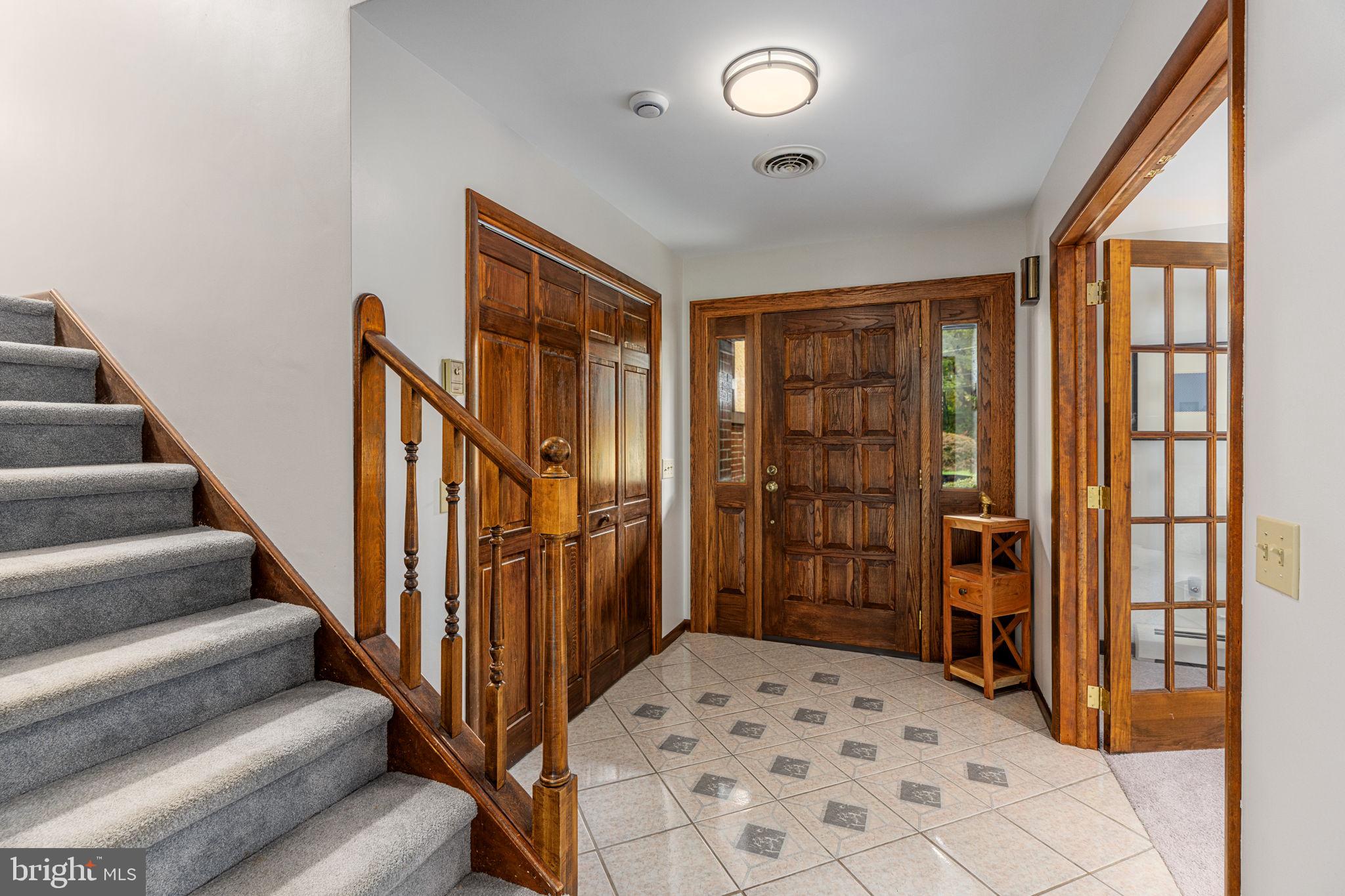 1995 Peppermint Road Coopersburg, PA 18036 - Photo 8 of 67 a view of a hallway with wooden floor and stairs