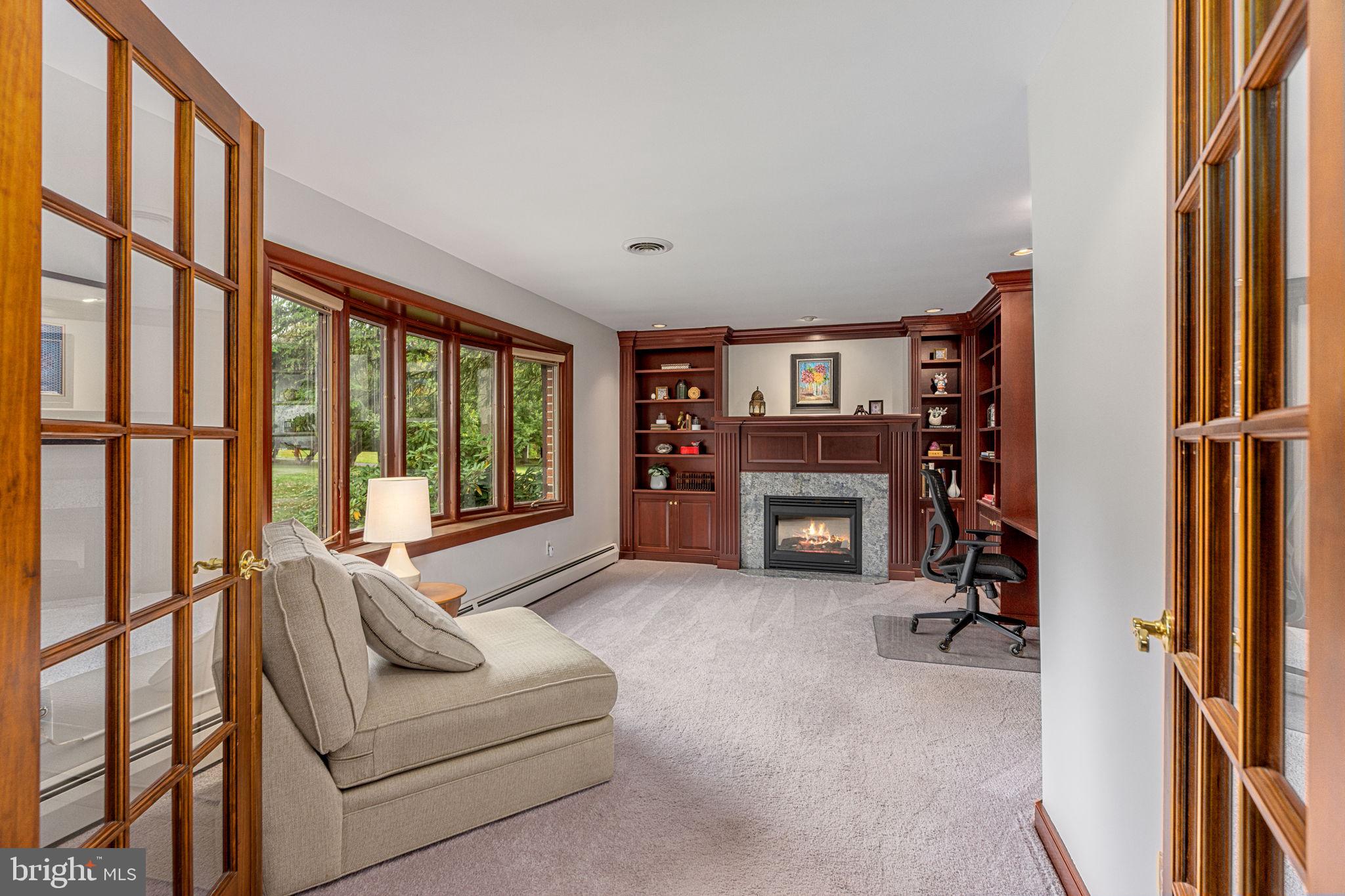1995 Peppermint Road Coopersburg, PA 18036 - Photo 10 of 67 a living room with furniture a fireplace and a large window