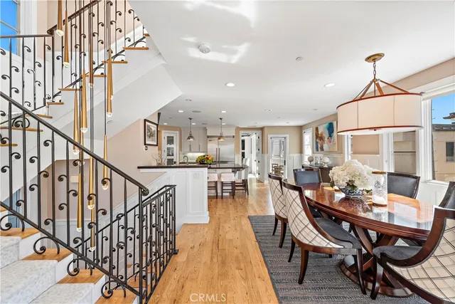 a dining room with furniture and wooden floor