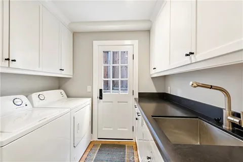 a kitchen that has a sink and a stove