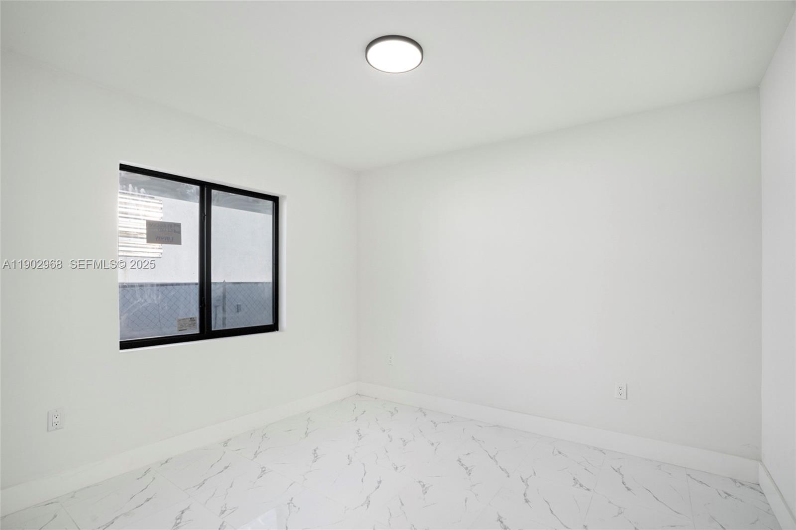 10362 Southwest 180th Street Miami, FL 33157 - Photo 11 of 18 an empty room with windows and closet