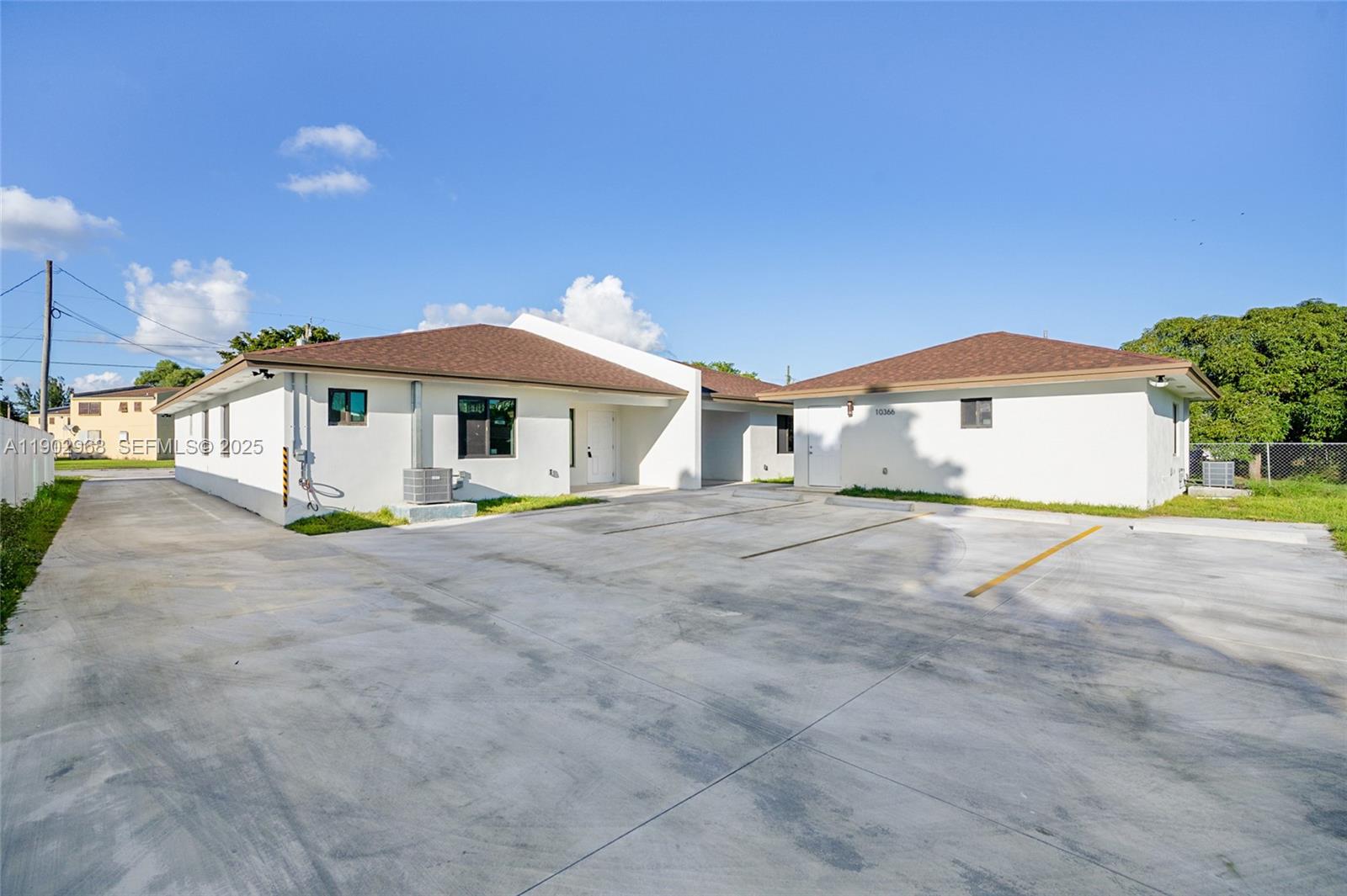 10362 Southwest 180th Street Miami, FL 33157 - Photo 13 of 18 a view of a house with a yard and sitting area