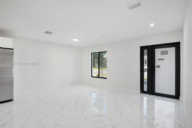 a view of an empty room with a window