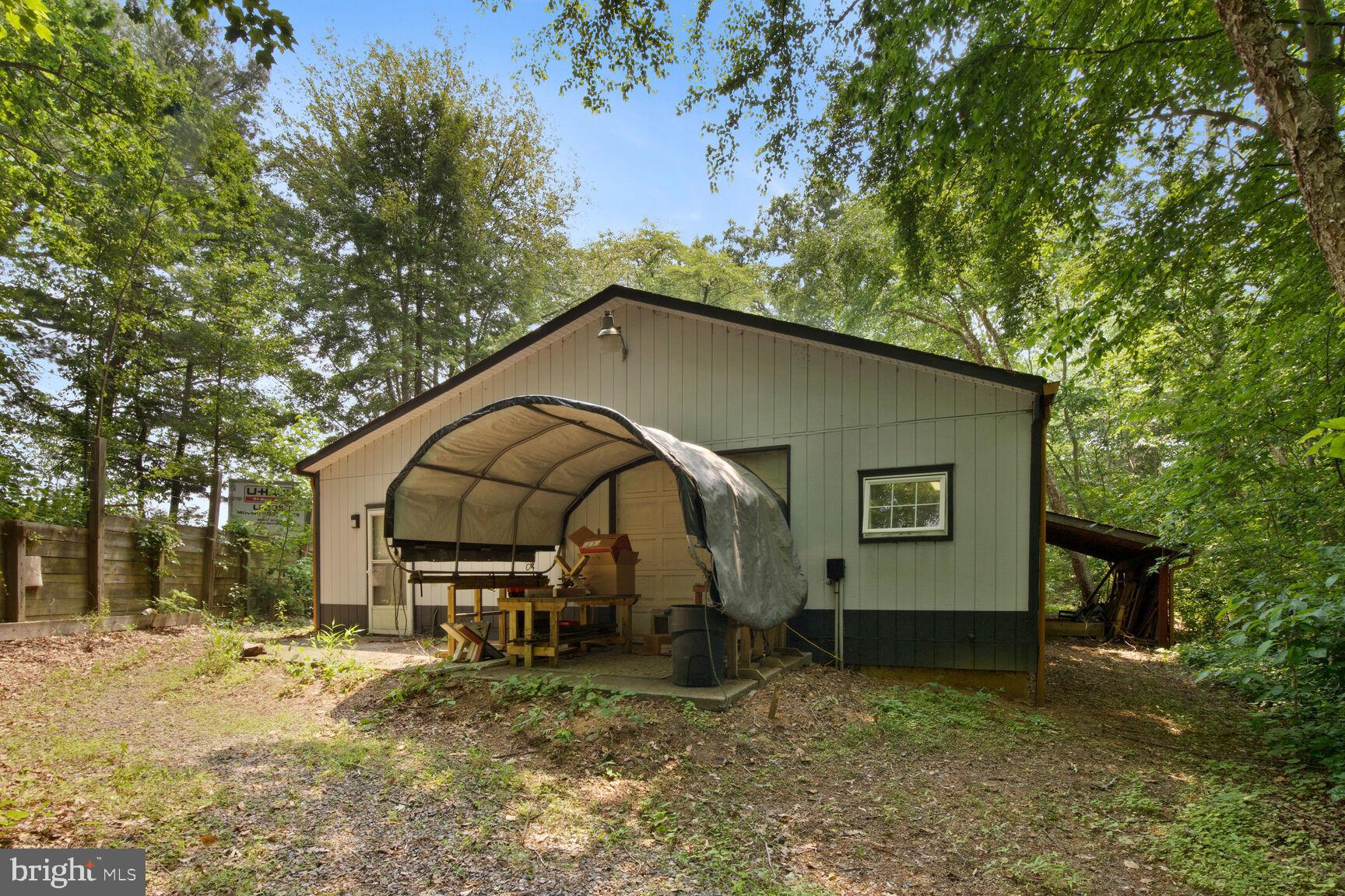 315 Ellisdale Road Chesterfield, NJ 08515 - Photo 41 of 45 a backyard of a house with table and chairs