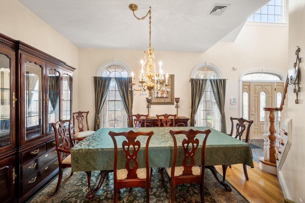 332 Division Road Dartmouth, MA 02748 - Photo 12 of 42 a view of a dining room with furniture window and wooden floor