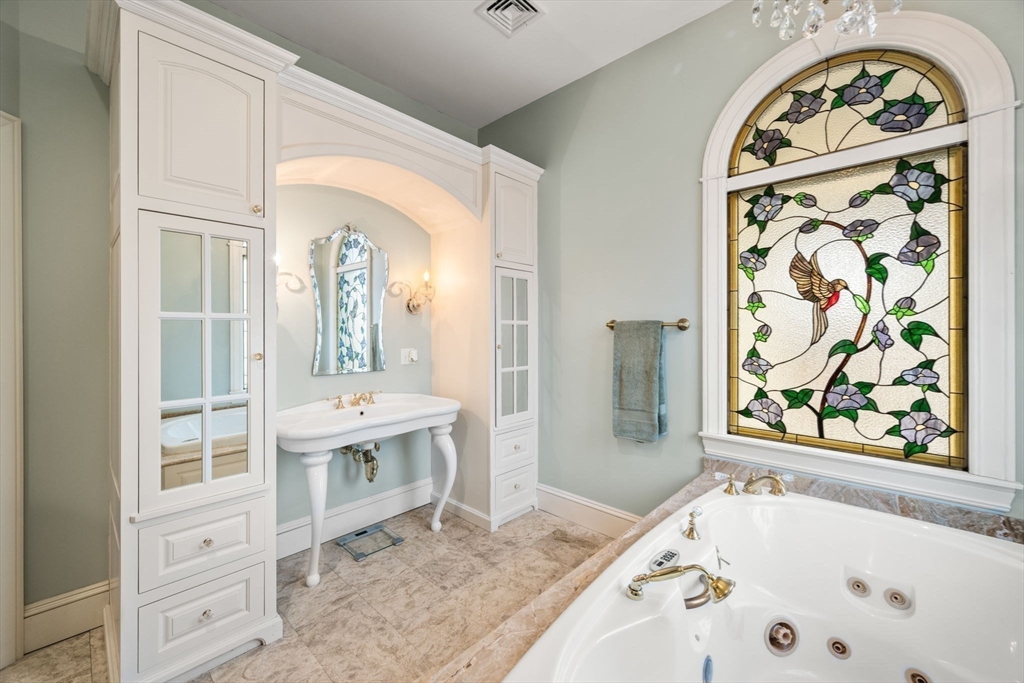 332 Division Road Dartmouth, MA 02748 - Photo 15 of 42 a bathroom with a bathtub and a sink