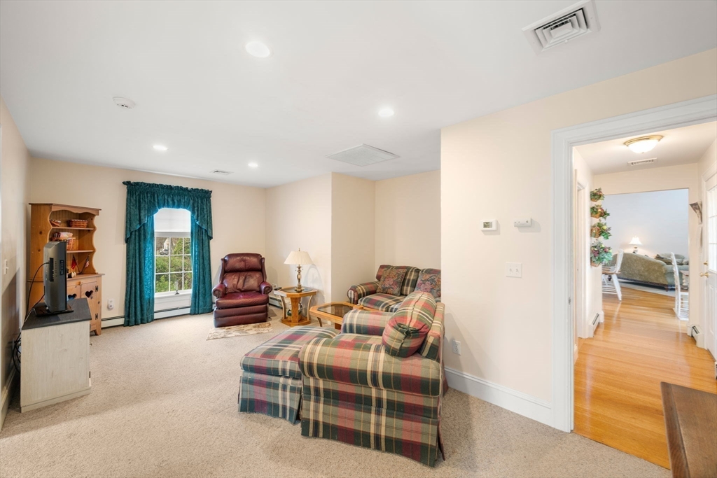 332 Division Road Dartmouth, MA 02748 - Photo 19 of 42 a bed room with a bed and a mirror