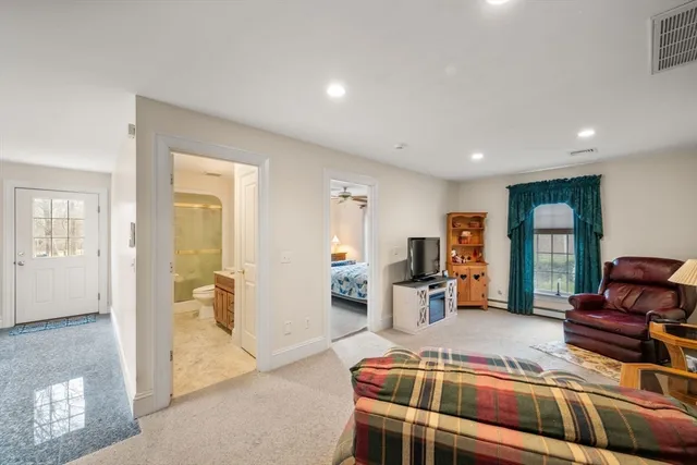 a bedroom with furniture and a wooden floor