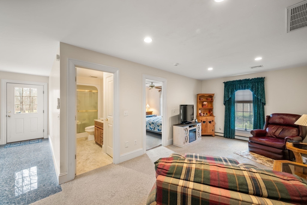 332 Division Road Dartmouth, MA 02748 - Photo 20 of 42 a bedroom with furniture and a wooden floor