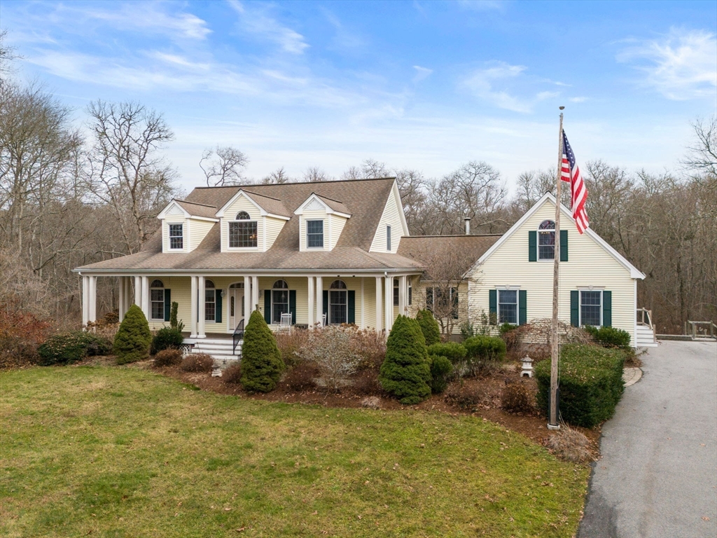 332 Division Road Dartmouth, MA 02748 - Photo 2 of 42 a view of a house with a garden and plants