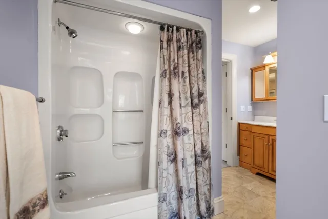a bathroom with a shower and a tub