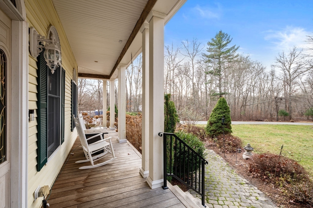 332 Division Road Dartmouth, MA 02748 - Photo 30 of 42 a balcony with chairs and wooden floor
