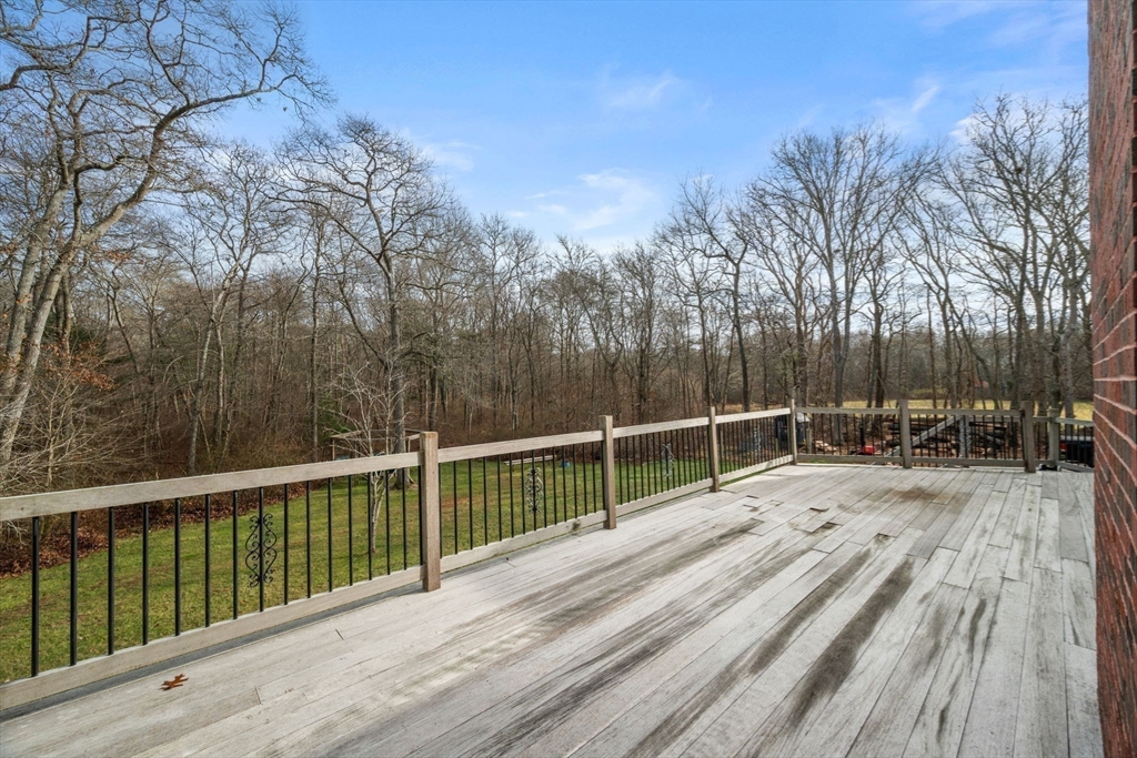 332 Division Road Dartmouth, MA 02748 - Photo 33 of 42 a view of a wooden deck with trees