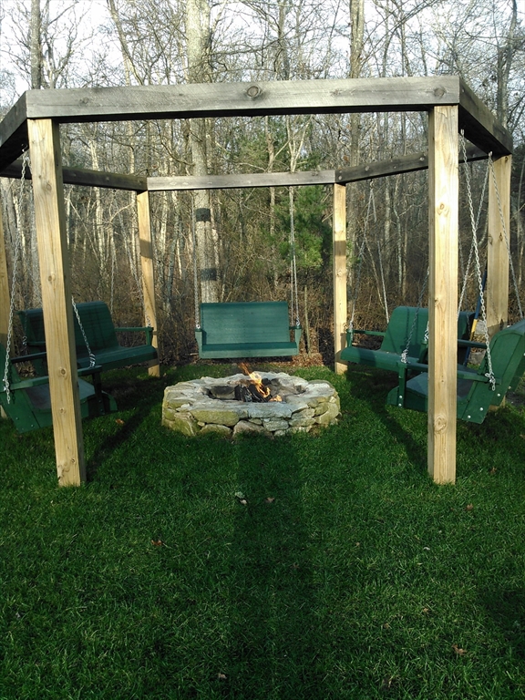 332 Division Road Dartmouth, MA 02748 - Photo 35 of 42 a view of a two chairs in the garden