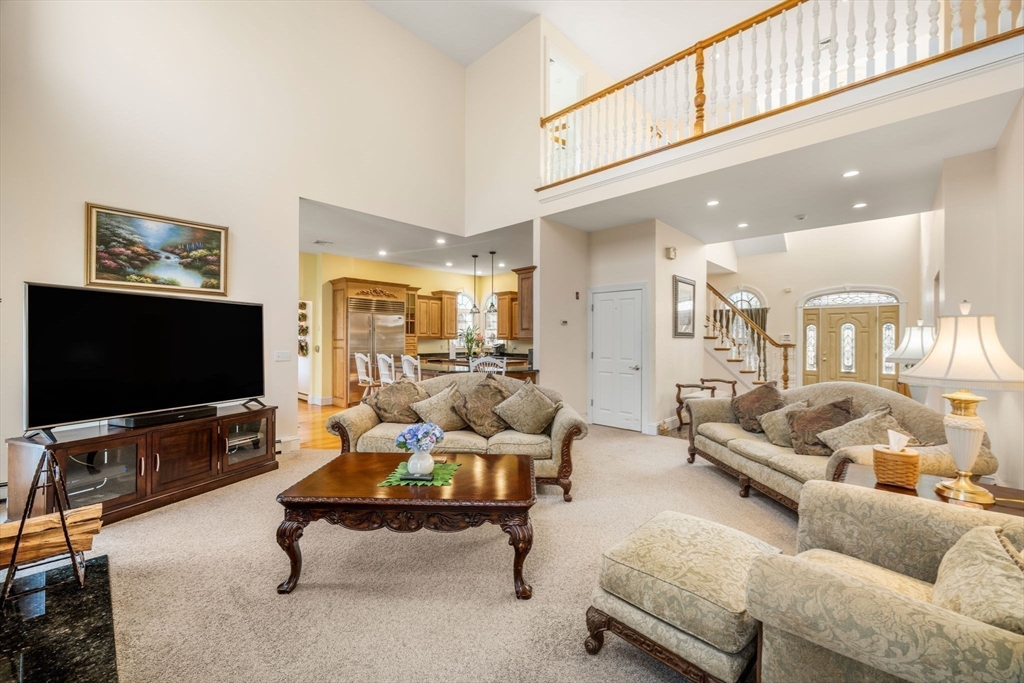332 Division Road Dartmouth, MA 02748 - Photo 4 of 42 a living room with furniture and a flat screen tv
