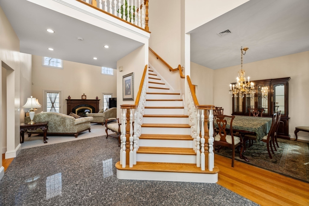 332 Division Road Dartmouth, MA 02748 - Photo 5 of 42 a living room with furniture and a chandelier