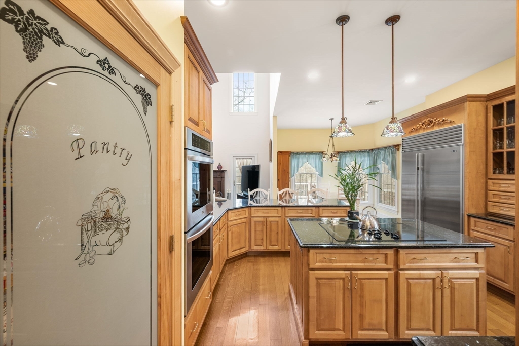 332 Division Road Dartmouth, MA 02748 - Photo 8 of 42 a view of a kitchen with a sink and wooden floor