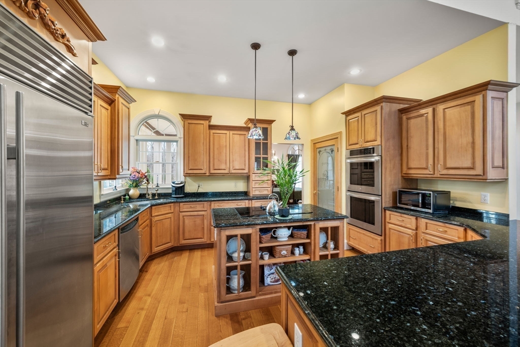 332 Division Road Dartmouth, MA 02748 - Photo 8 of 42 a kitchen with stainless steel appliances granite countertop sink stove and refrigerator