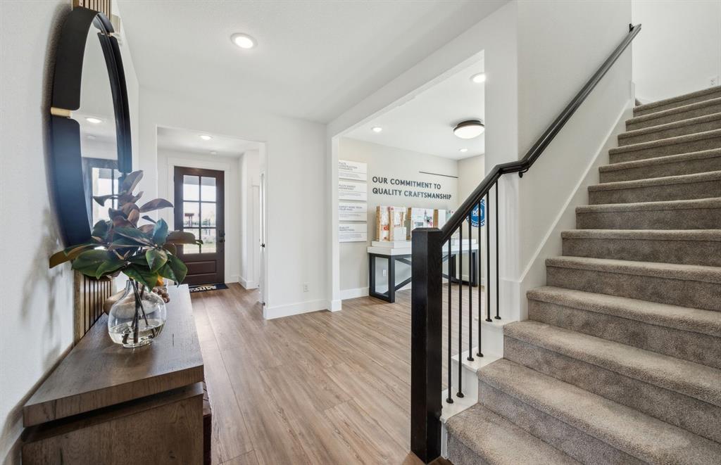 1609 Tyler Drive Anna, TX 75409 - Photo 2 of 16 a view of entryway and hall with wooden floor