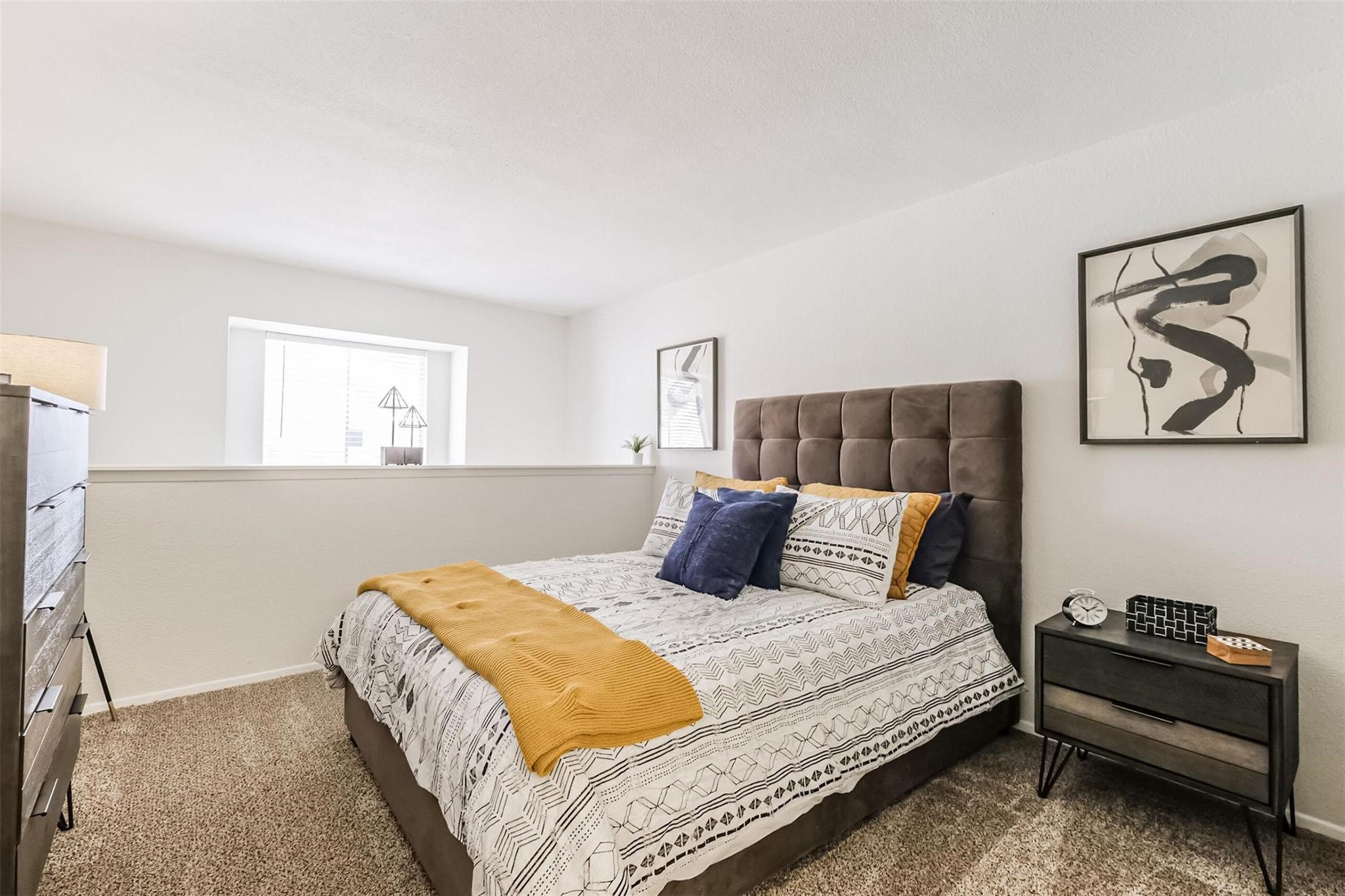 8162 Richmond Avenue, Unit 1803 Houston, TX 77063 - Photo 11 of 33 a bedroom with a bed and a couch