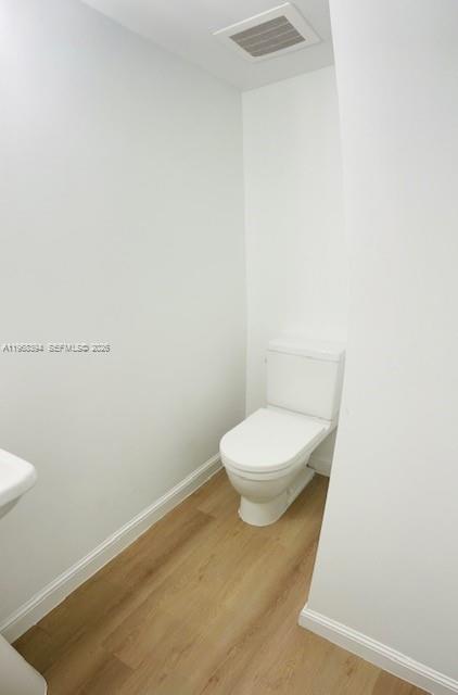 185 Southwest 7th Street, Unit 1605 Miami, FL 33130 - Photo 20 of 22 a white toilet sitting next to a white sink
