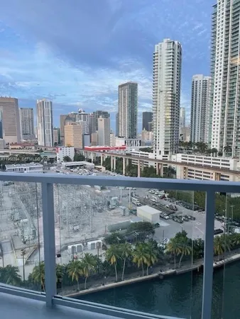 a view of balcony with two chairs and a table