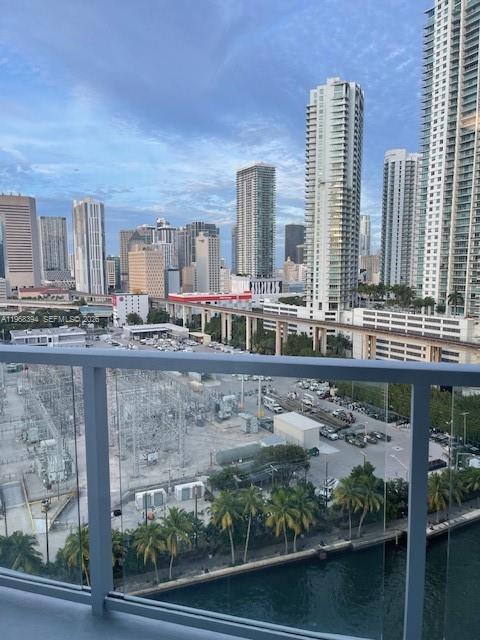 185 Southwest 7th Street, Unit 1605 Miami, FL 33130 - Photo 2 of 22 a view of balcony with two chairs and a table