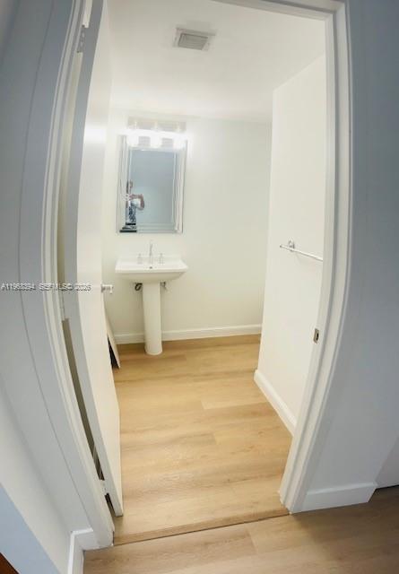 185 Southwest 7th Street, Unit 1605 Miami, FL 33130 - Photo 21 of 22 a view of a bathroom with bathtub and sink