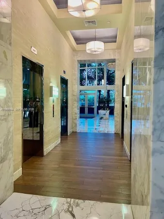 a view of a park with large trees