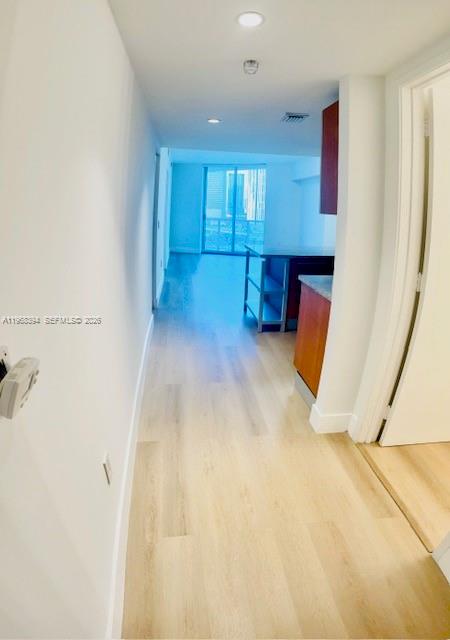 185 Southwest 7th Street, Unit 1605 Miami, FL 33130 - Photo 10 of 22 a view of a hallway with seating area