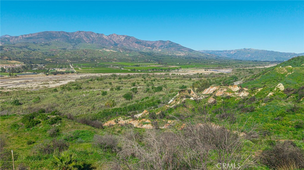 18500 South Mountain Road Santa Paula, CA 93060 - Photo 13 of 35 a view of a lush green hillside and a building