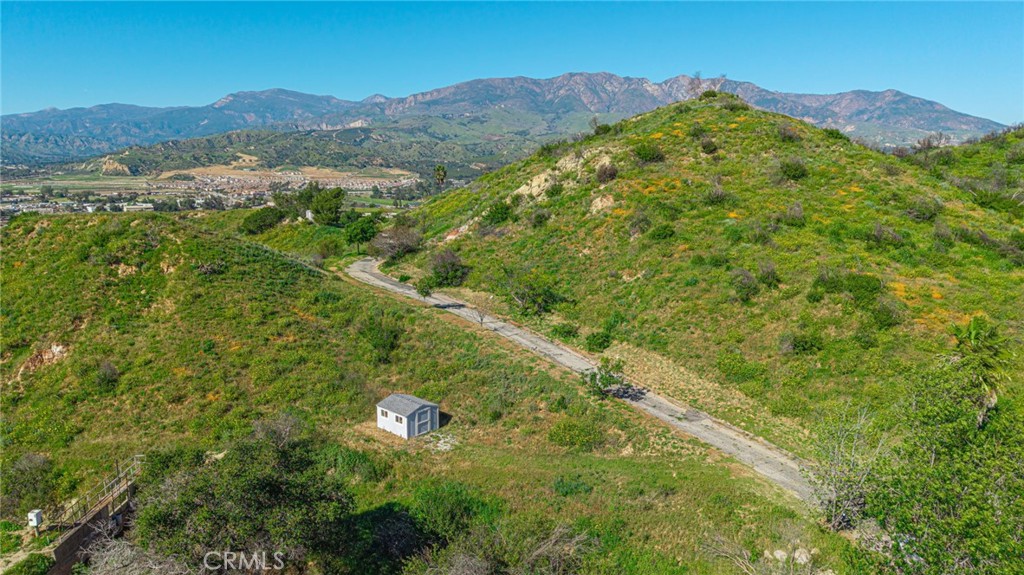 18500 South Mountain Road Santa Paula, CA 93060 - Photo 17 of 35 a view of a lush green hillside and a houses